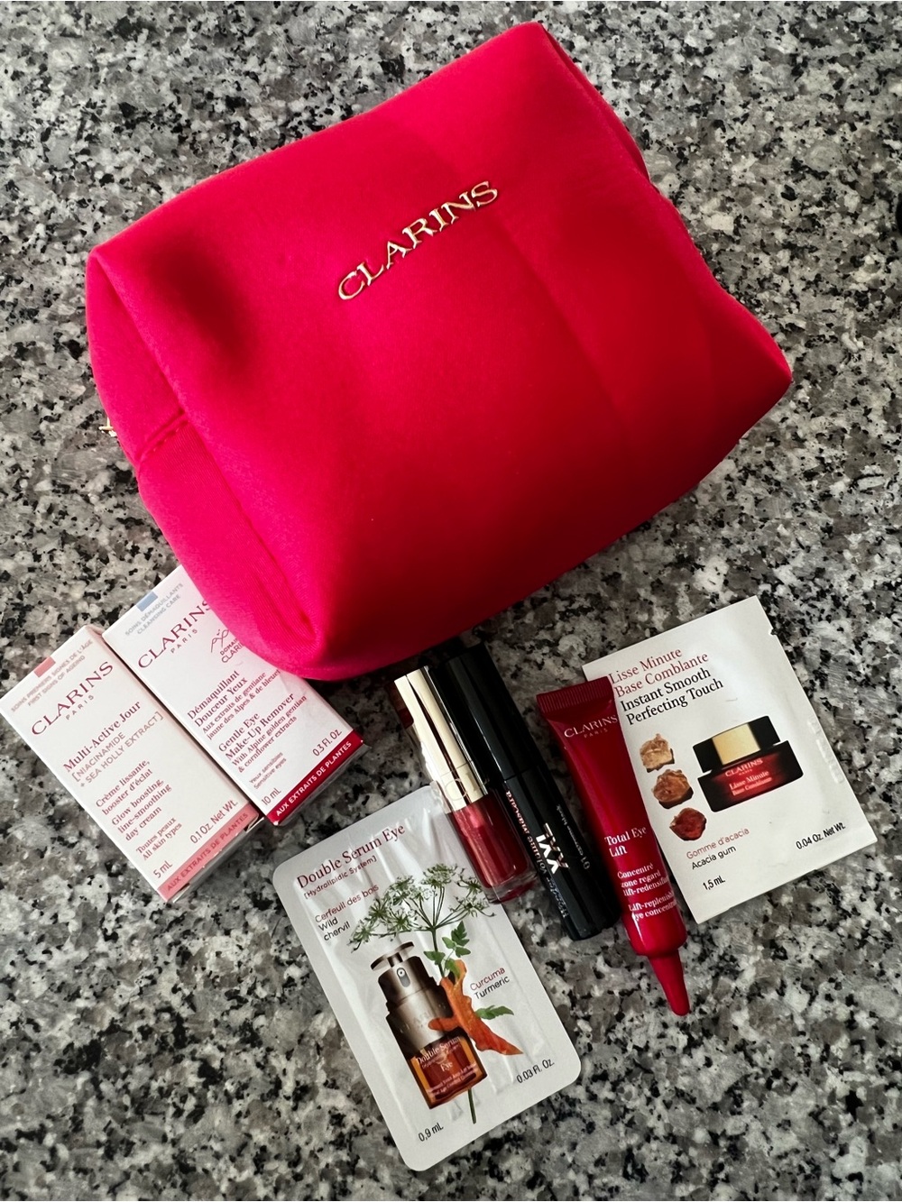 Clarins Bright Pink Cosmetic Pouch with Skincare & Lip Samples